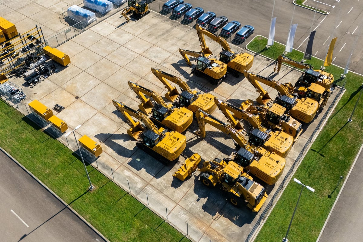 Construction machinery and heavy equipment being cleaned - professional pressure washing service
